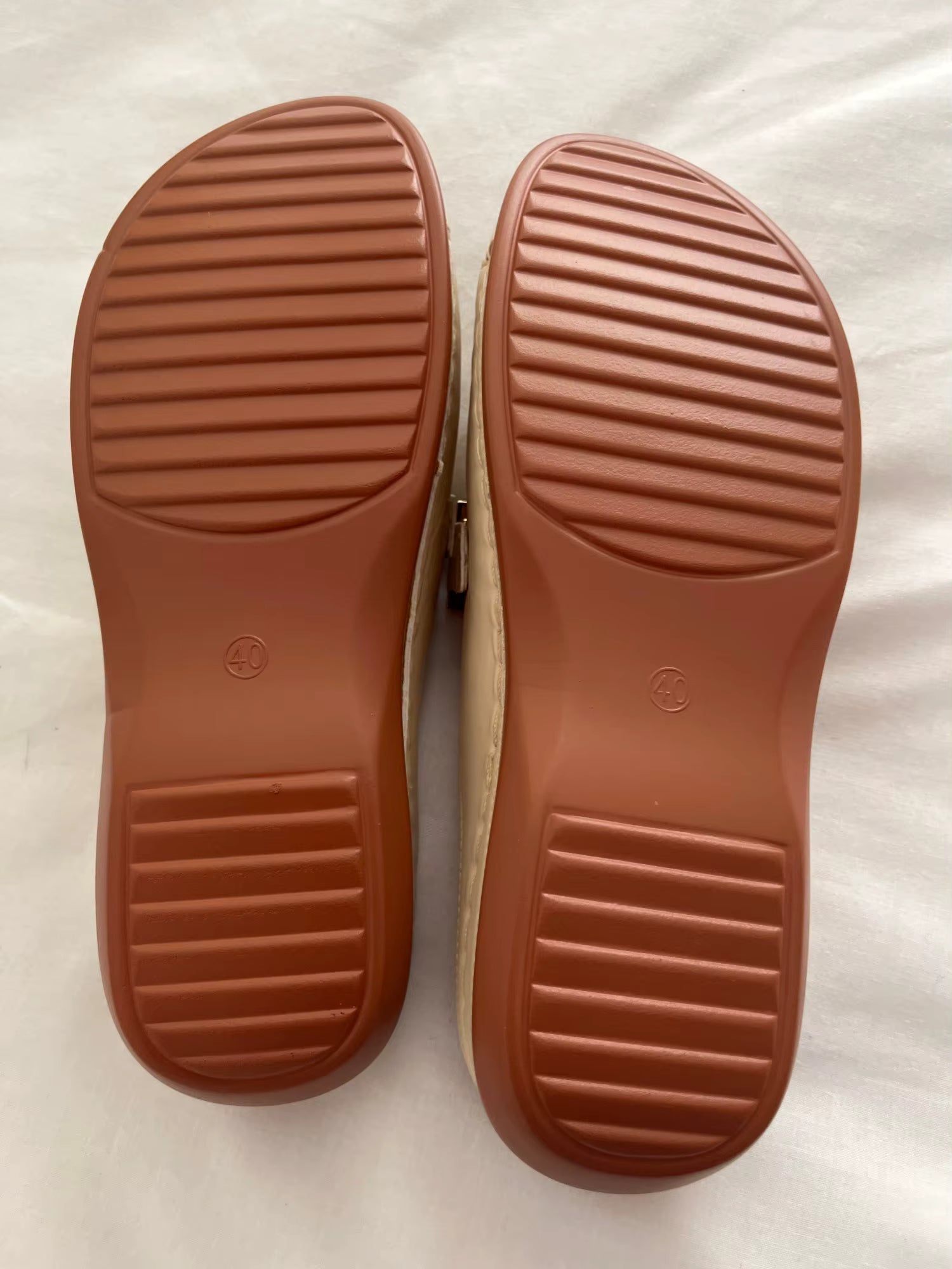 A pair of Christine Brewer Adele orthopedic wedge heel sandals for women, featuring comfortable strap design and neutral color.