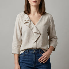 Apricot V-neck denim ruffle summer blouse for women by Christine Brewer, featuring a stylish and breathable top with ruffle details.