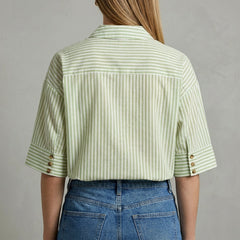 Back view of Christine Brewer women's striped linen summer blouse with long sleeves and relaxed fit.