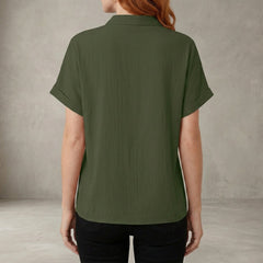 Back view of Christine Brewer women's summer blouse featuring a V-neck denim ruffle design, casual and stylish for warm weather.