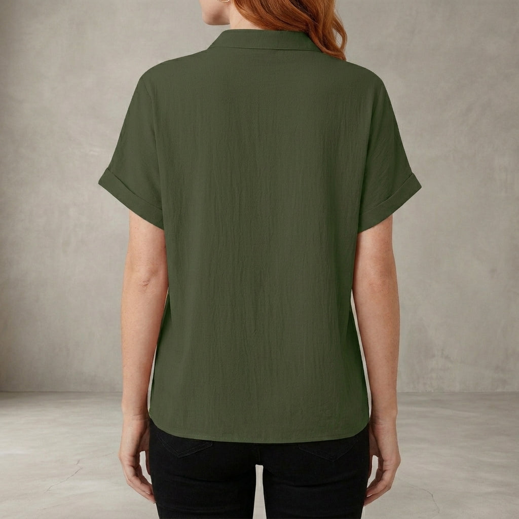 Back view of Christine Brewer women's summer blouse featuring a V-neck denim ruffle design, casual and stylish for warm weather.