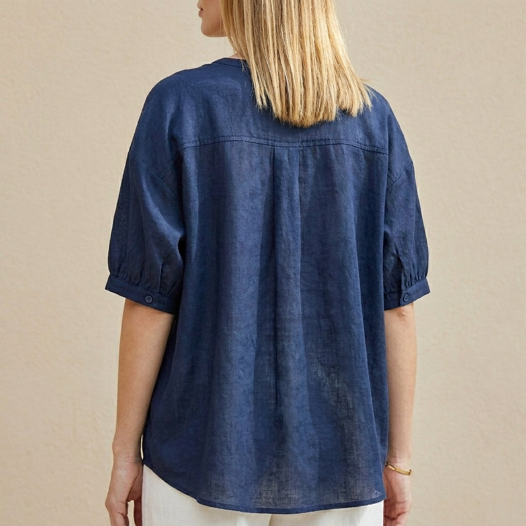 Back view of Christine Brewer women's summer blouse with V-neck and puff sleeves, stylish and lightweight top for warm weather.