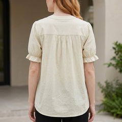 Back view of Christine Brewer women's summer blouse with puff sleeves, denim fabric, and button-front design.