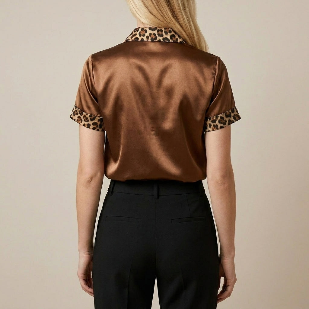 Leopard print summer blouse for women by Christine Brewer, short sleeve top shown from the back.