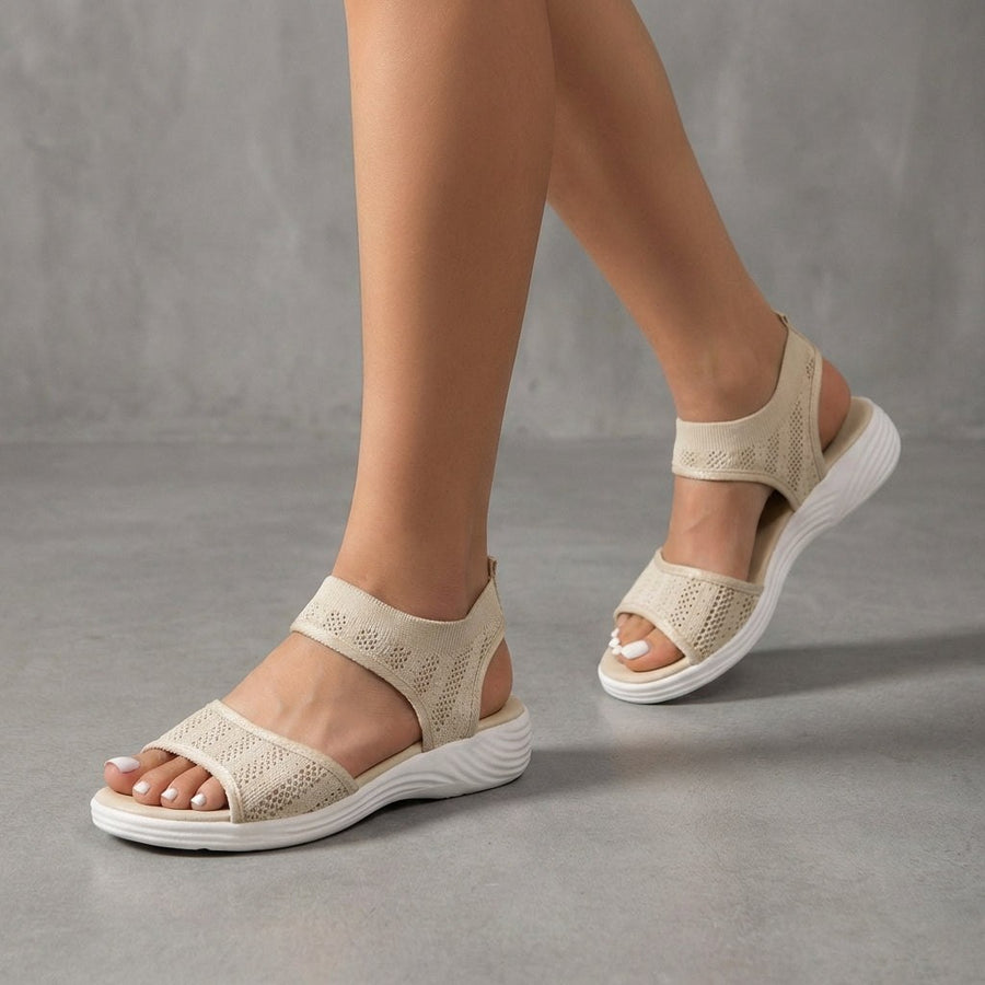 Beige knit ankle-strap sandals for women by Christine Brewer, featuring open toes and stylish ankle straps.