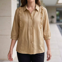 Beige denim ruffle summer blouse for women by Christine Brewer, featuring a stylish and light fabric design.
