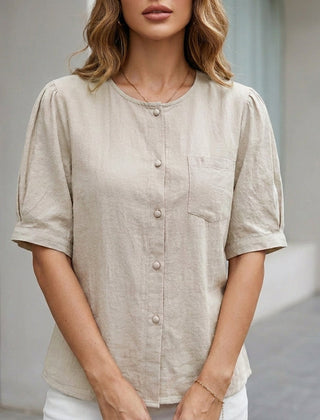 Beige women's summer blouse with short sleeves and front pockets, made of linen by Christine Brewer.