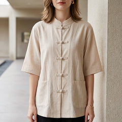 Beige women's summer blouse with denim pockets from Christine Brewer, featuring a casual, sleeveless top design.