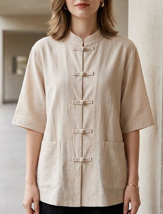 Beige women's summer blouse with denim pockets from Christine Brewer, featuring a casual, sleeveless top design.