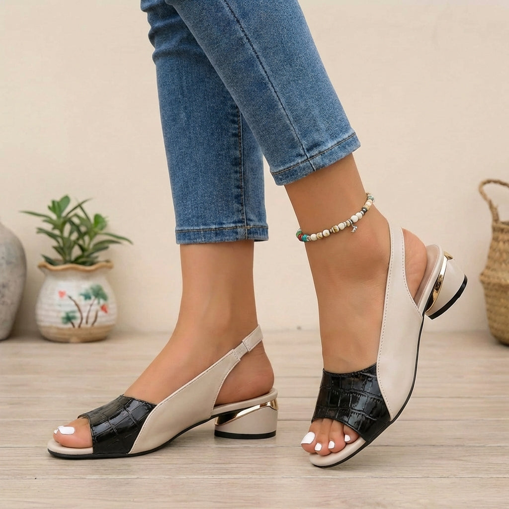 Black textured slingback block heel sandals with open toe and gold accent from Christine Brewer, stylish and comfortable footwear.