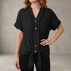 Black women's summer blouse with V-neck, denim fabric, and ruffle details, casual top by Christine Brewer.