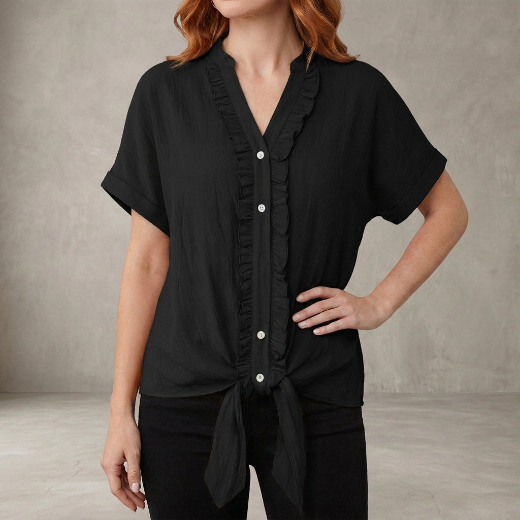 Black women's summer blouse with V-neck, denim fabric, and ruffle details, casual top by Christine Brewer.