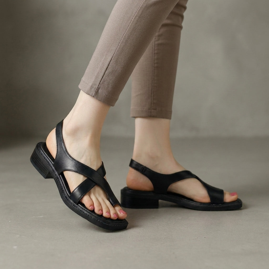 Black square-toe block-heel criss-cross sandals for women by Christine Brewer, showcasing stylish design and comfortable fit.