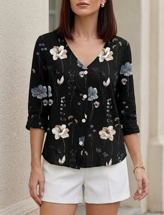 Black floral V-neck summer blouse for women by Christine Brewer, featuring denim buttons and a relaxed fit.