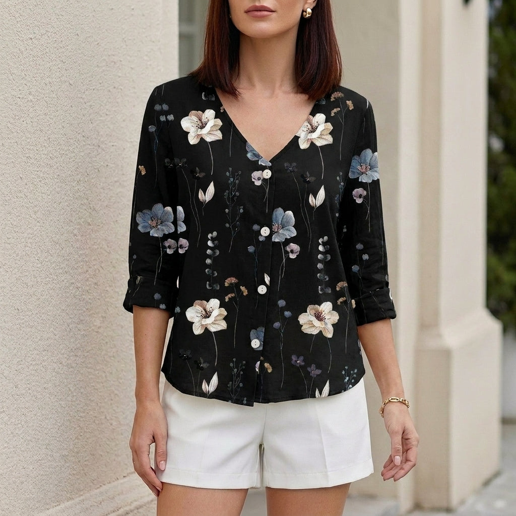Black floral V-neck summer blouse for women by Christine Brewer, featuring denim buttons and a relaxed fit.