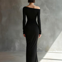 Black jersey ruched maxi dress by Christine Brewer, evening dress with fitted bodice and flowing skirt, suitable for formal occasions.