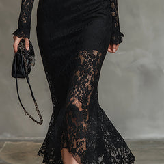 Black lace fishtail maxi dress by Christine Brewer, featuring intricate lace details and a fitted evening dress silhouette.