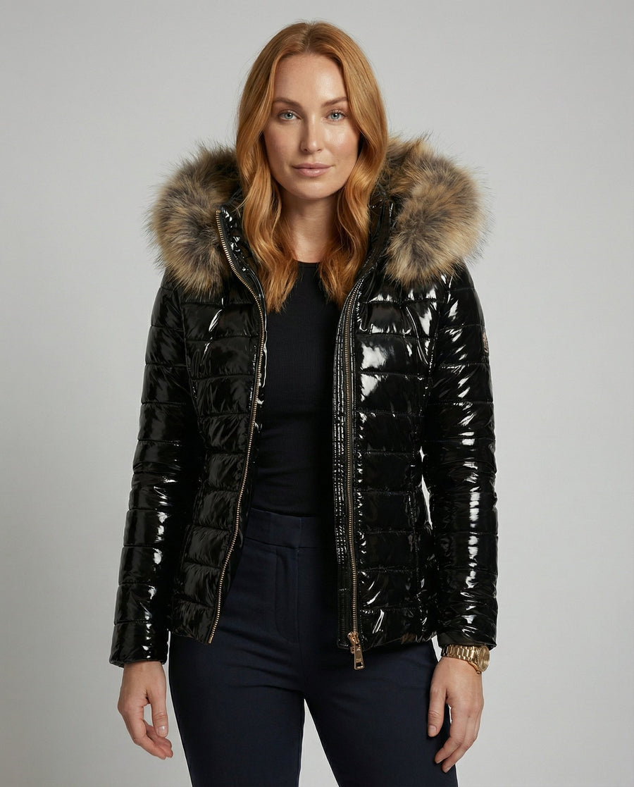 Black hooded puffer jacket for women from Christine Brewer, shown on a woman with the jacket's upper body details visible.
