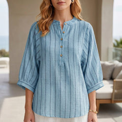 Blue striped linen summer blouse for women by Christine Brewer, featuring a button front and relaxed fit.