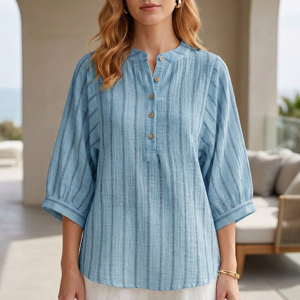 Blue striped linen summer blouse for women by Christine Brewer, featuring a button front and relaxed fit.