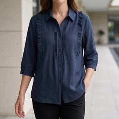 Blue denim summer blouse for women with ruffle details, stylish top by Christine Brewer, ideal for warm-weather outfits.
