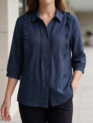 Blue denim summer blouse for women with ruffle details, stylish top by Christine Brewer, ideal for warm-weather outfits.