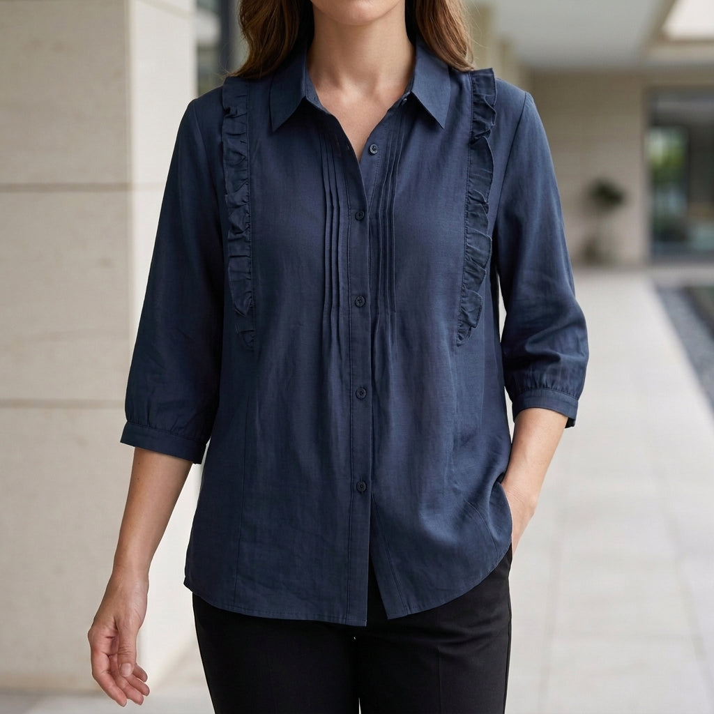 Blue denim summer blouse for women with ruffle details, stylish top by Christine Brewer, ideal for warm-weather outfits.