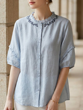 Blue linen ruffle summer blouse for women, stylish top from Christine Brewer with feminine details and lightweight fabric.