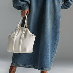 Blue denim maxi dress by Christine Brewer featuring a flowing design, sleeveless style, and casual evening wear look.