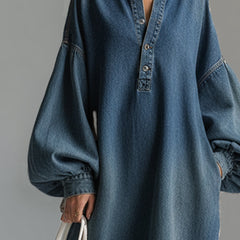 Blue denim maxi dress by Christine Brewer, featuring a flowing silhouette and casual-chic style, perfect for evening or daytime wear.