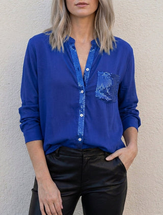 Blue denim summer blouse for women with V-neck and button front by Christine Brewer, casual top for warm weather.