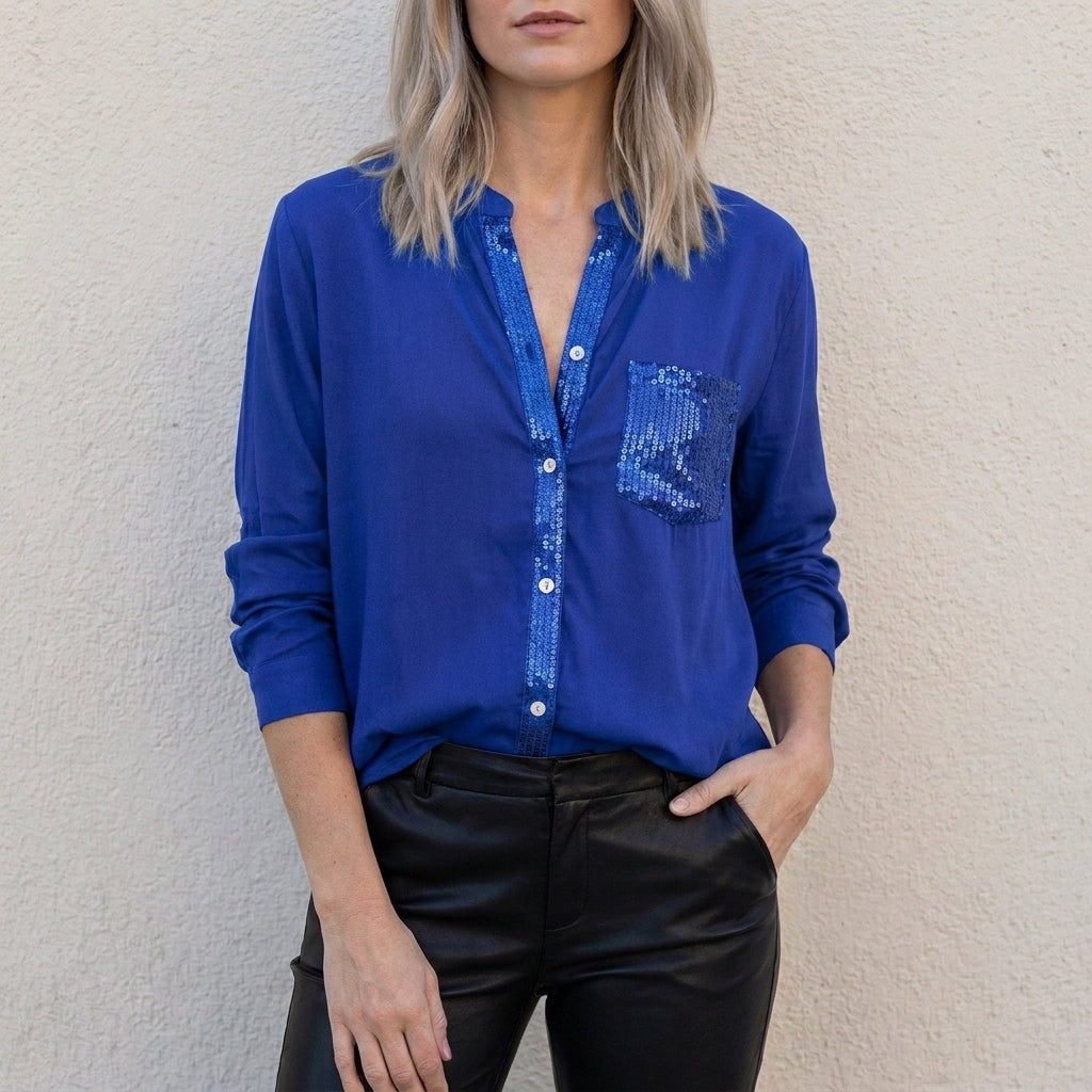 Blue denim summer blouse for women with V-neck and button front by Christine Brewer, casual top for warm weather.