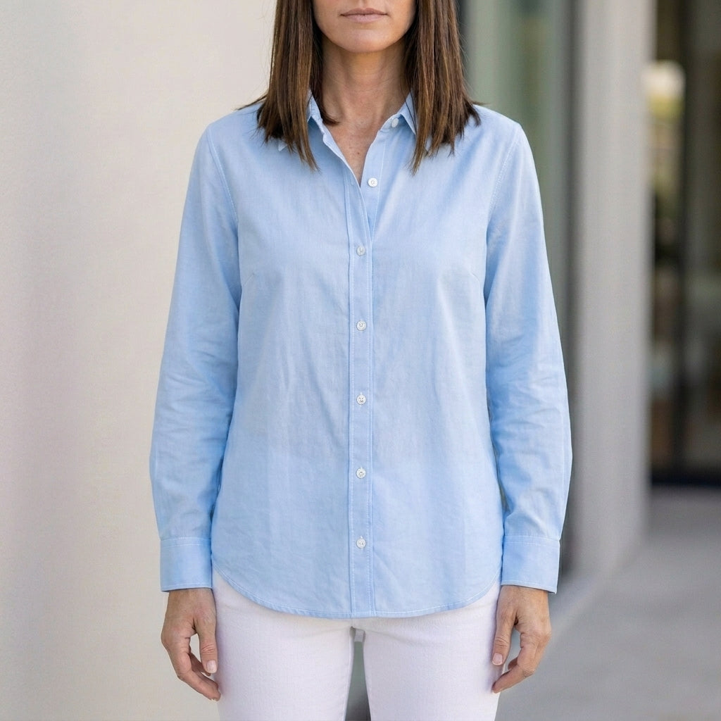 Blue linen summer blouse for women with button front, by Christine Brewer, stylish and breathable top for warm weather.
