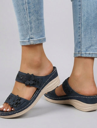 Blue floral strap wedge heeled sandals for women by Christine Brewer, featuring a stylish design and comfortable heel height.