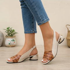 Brown textured slingback block heel sandals with open toe and gold accent by Christine Brewer.