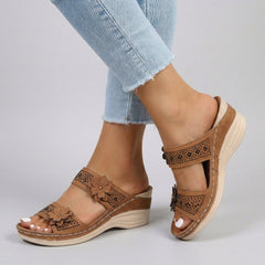 Brown floral strap wedge heeled sandals for women by Christine Brewer, featuring a stylish design and comfortable footwear.