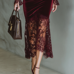 Burgundy velvet maxi evening dress by Christine Brewer featuring a flowing silhouette and elegant design.