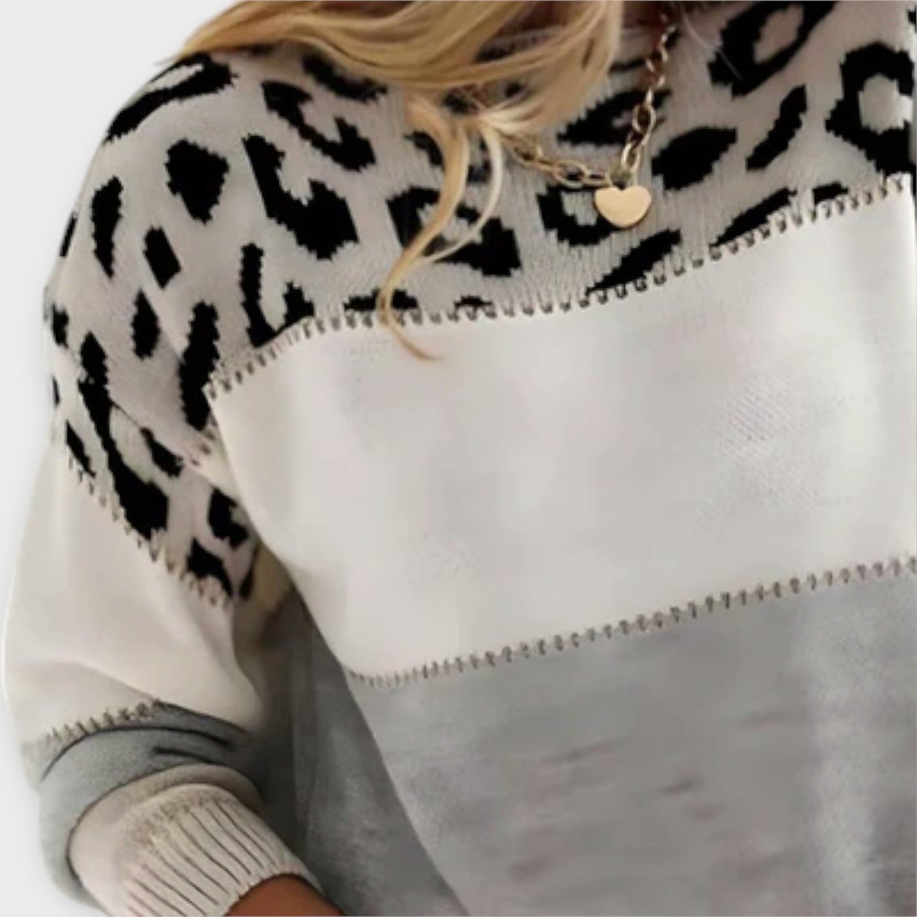 Leopard print graphic sweater for women by Christine Brewer, featuring gray tones and stylish design, worn casually.