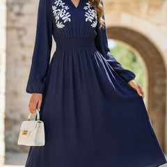 Light blue embroidered waist V-neck dress by Christine Brewer, featuring elegant design and intricate embroidery detail.
