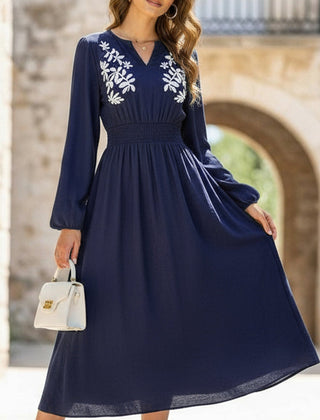 Light blue embroidered waist V-neck dress by Christine Brewer, featuring elegant design and intricate embroidery detail.
