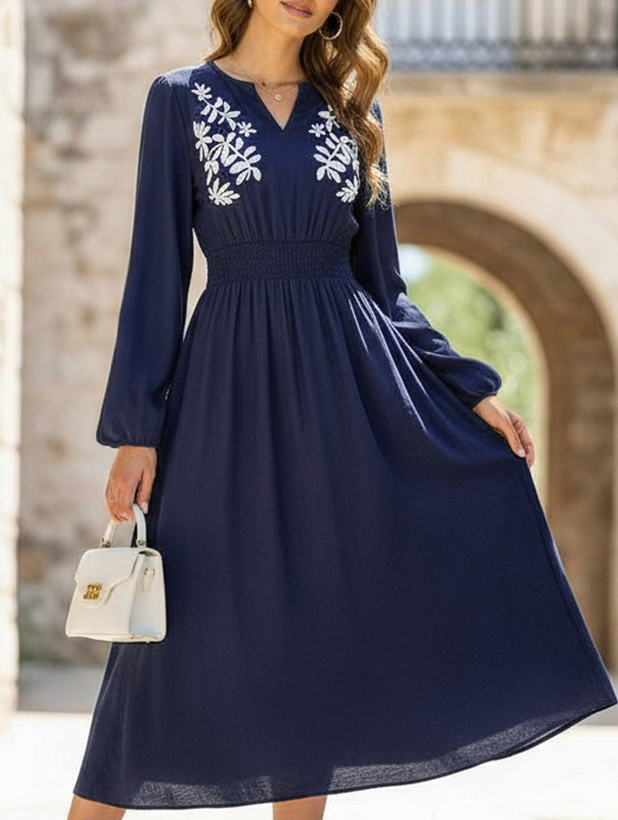 Light blue embroidered waist V-neck dress by Christine Brewer, featuring elegant design and intricate embroidery detail.