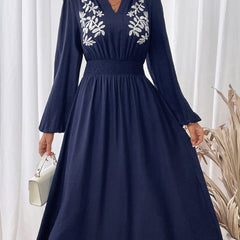 Light blue embroidered waist V-neck dress by Christine Brewer, featuring intricate embroidery and a flattering silhouette.