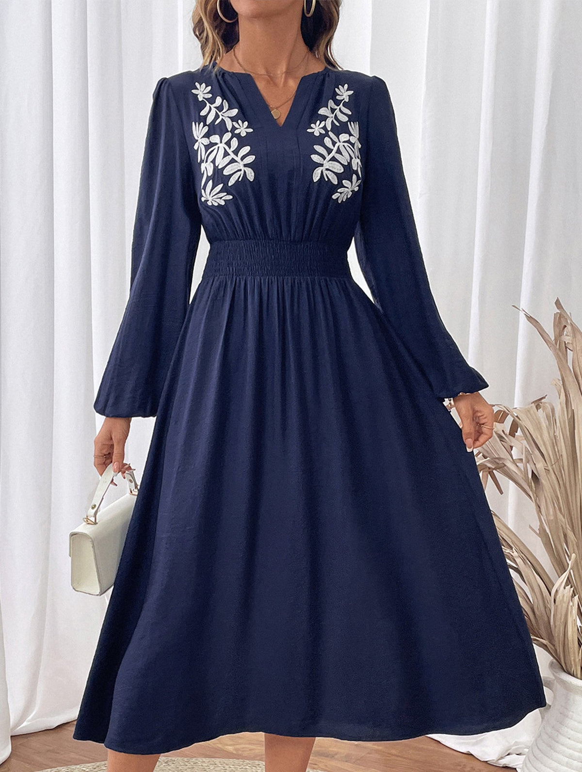 Light blue embroidered waist V-neck dress by Christine Brewer, featuring intricate embroidery and a flattering silhouette.