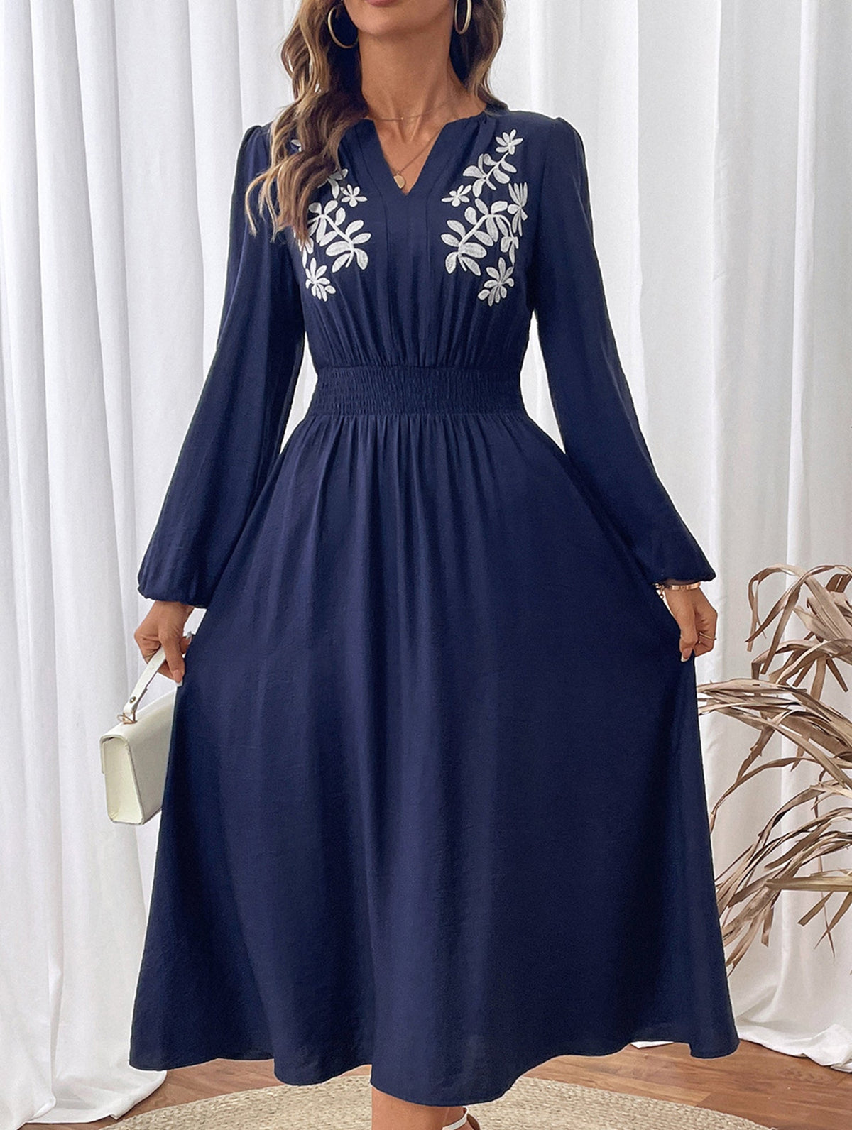 Light blue embroidered waist V-neck dress by Christine Brewer, showcasing intricate embroidery and elegant fit.