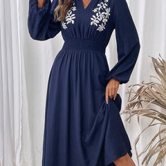 Light blue embroidered waist V-neck dress by Christine Brewer, featuring intricate embroidery and elegant fit.