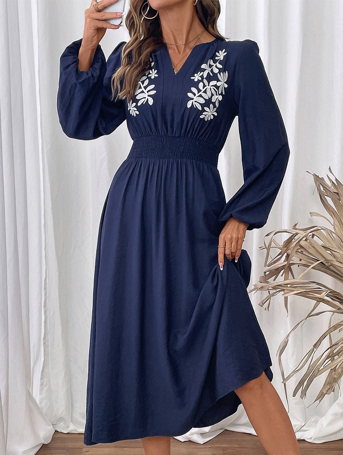 Light blue embroidered waist V-neck dress by Christine Brewer, featuring intricate embroidery and elegant fit.