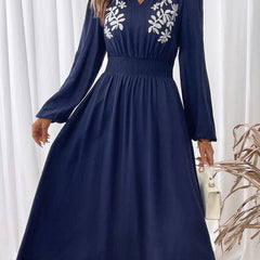 Light blue embroidered waist V-neck dress by Christine Brewer, featuring elegant detailing and a flattering fit.