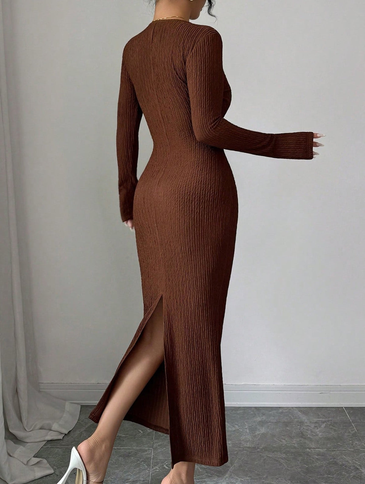 White cross neck knit slim-fit dress by Christine Brewer, featuring a stylish fit and design, displayed on a hanger.