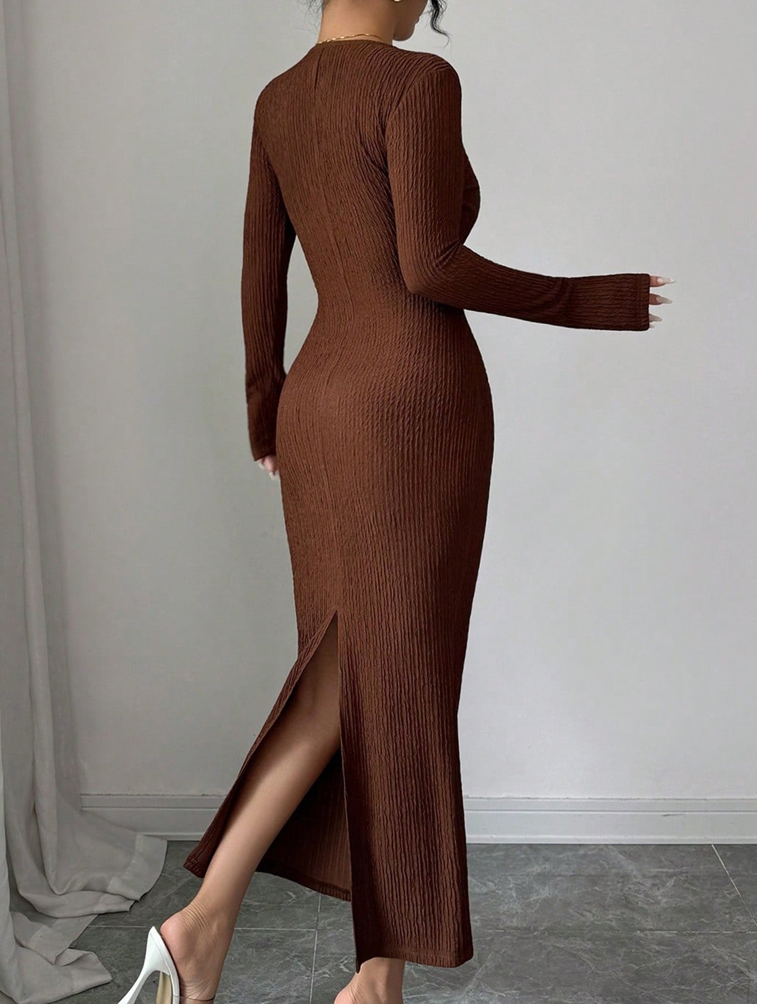 White cross neck knit slim-fit dress by Christine Brewer, featuring a stylish fit and design, displayed on a hanger.