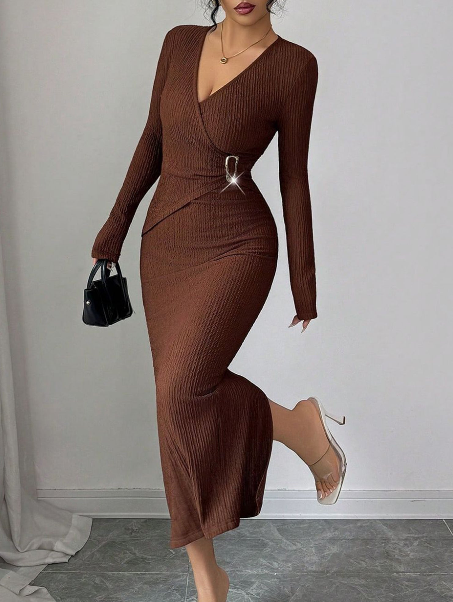 White cross-neck knit slim-fit dress by Christine Brewer, shown on a model with a stylish, modern design and soft fabric texture.